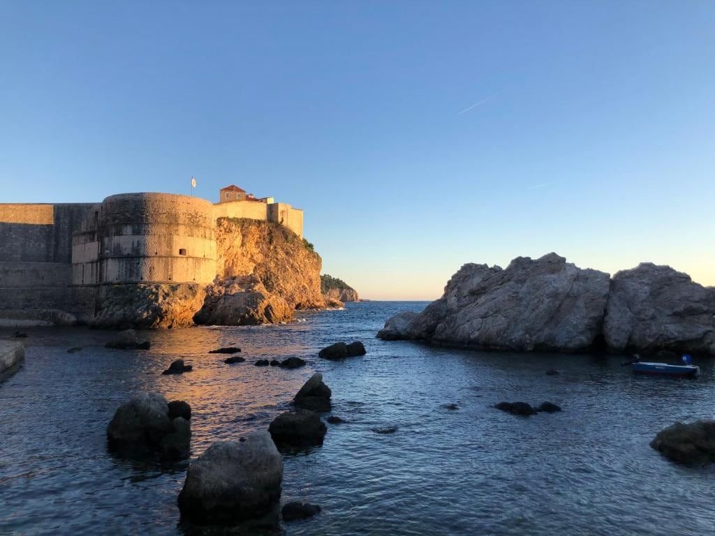 Fort Lovrijenac and the Dubrovnik city walls above the sea at sunset