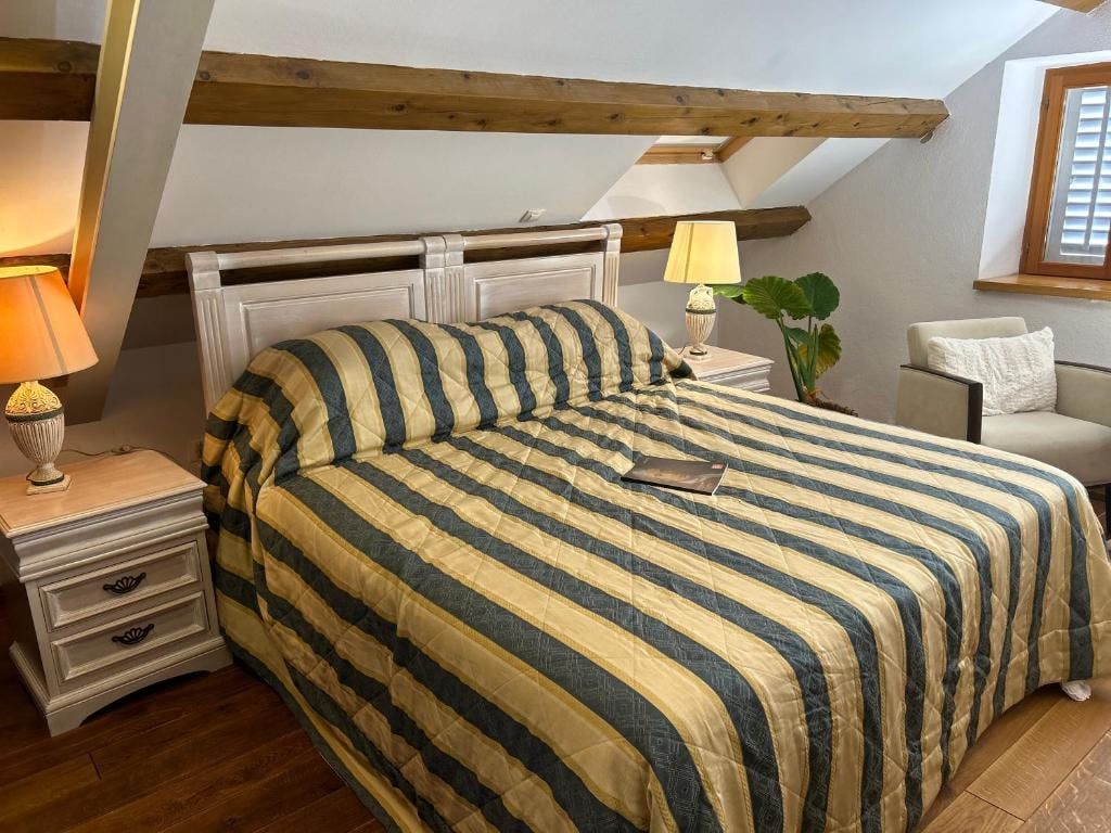 Deluxe Double Bedroom with a double bed under wooden beams