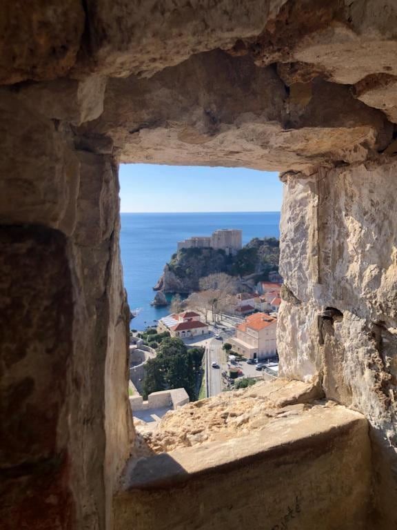 Dubrovnik Old Town seen through a stone window
