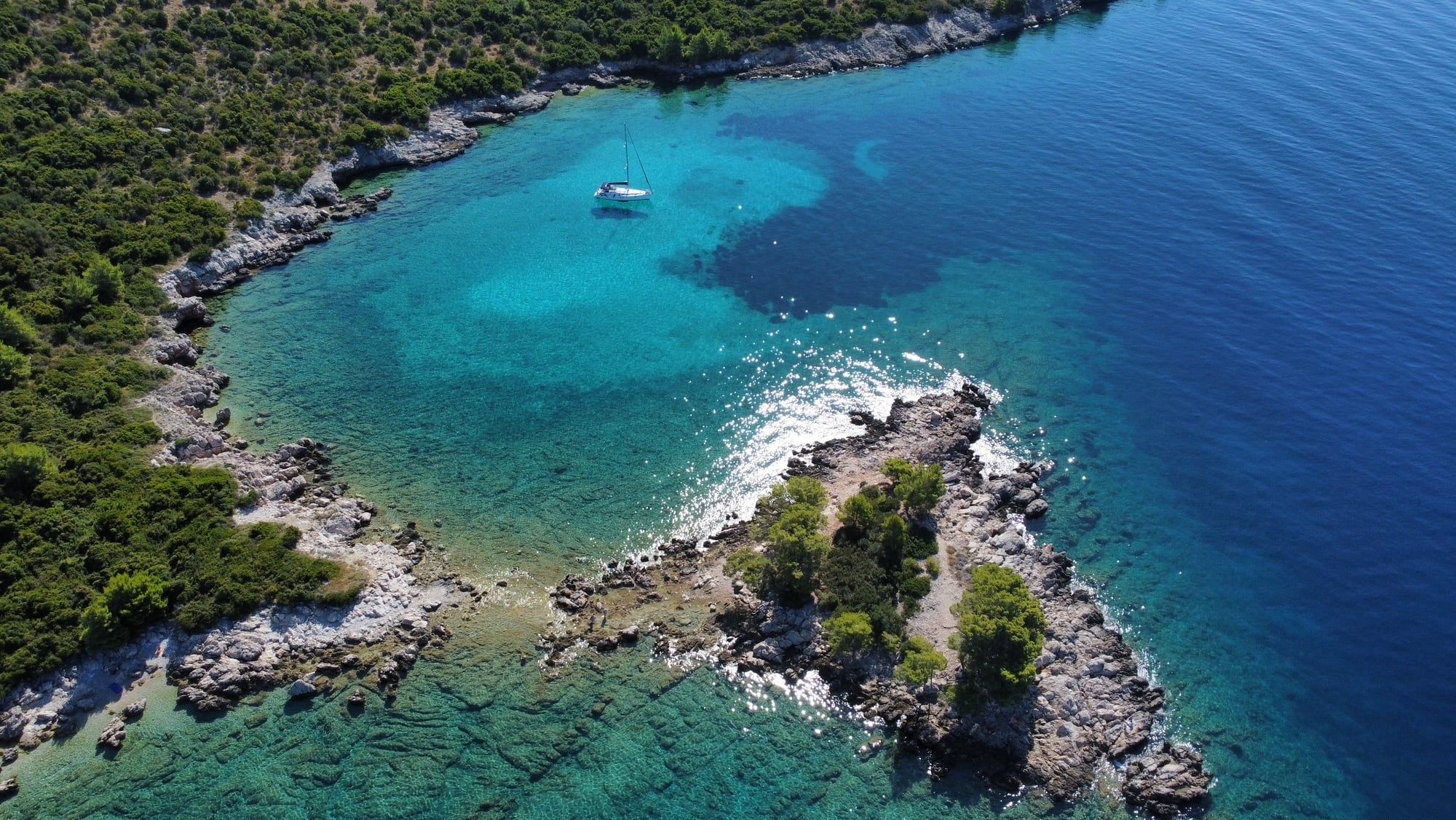 Turquoise bay of a wooded island near Dubrovnik, seen from above